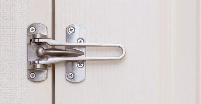 Door security latch installed on apartment door at Storrs Student Living