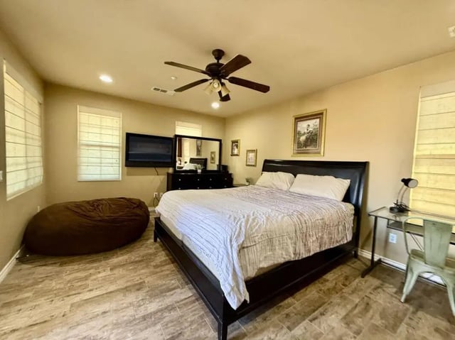 Bed TV dresser beanbag desk and chair bedroom at Universal Student Housing in Los Angeles Student Accommodation