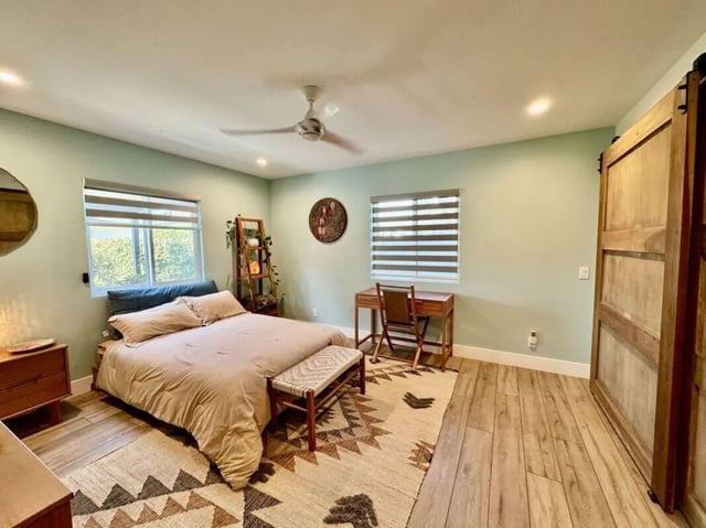 Bed desk shelving and a sliding door bedroom at Universal Student Housing in Los Angeles Student Accommodation