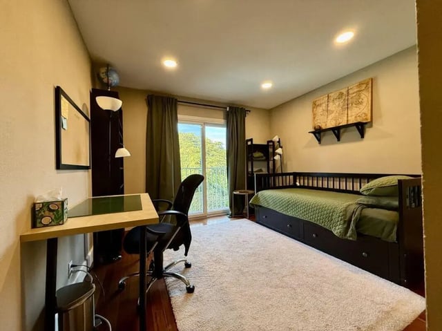 Desk chair bed with drawers and globe bedroom at Universal Student Housing in Los Angeles Student Accommodation