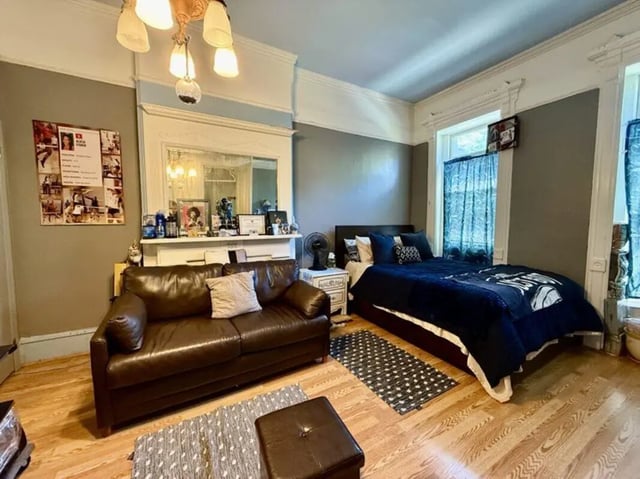 Leather sofa bed nightstand fan living room at Universal Student Housing in Los Angeles Student Accommodation