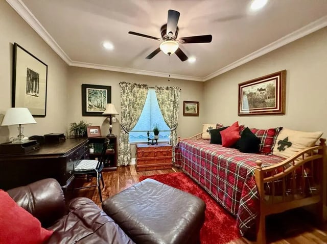 Daybed with red plaid blanket desk ottoman living room at Universal Student Housing in Los Angeles Student Accommodation