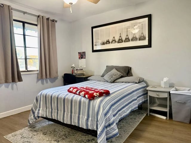 Bed desk chair and artwork bedroom at Universal Student Housing in Los Angeles Student Accommodation