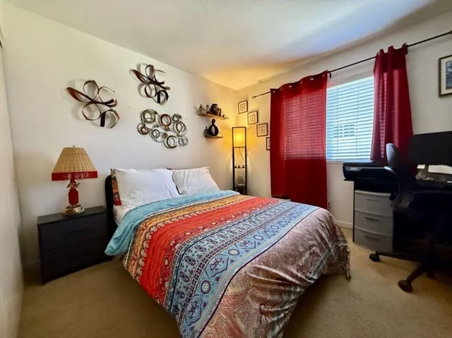 Bed nightstand lamp desk printer and chair bedroom at Universal Student Housing in Los Angeles Student Accommodation