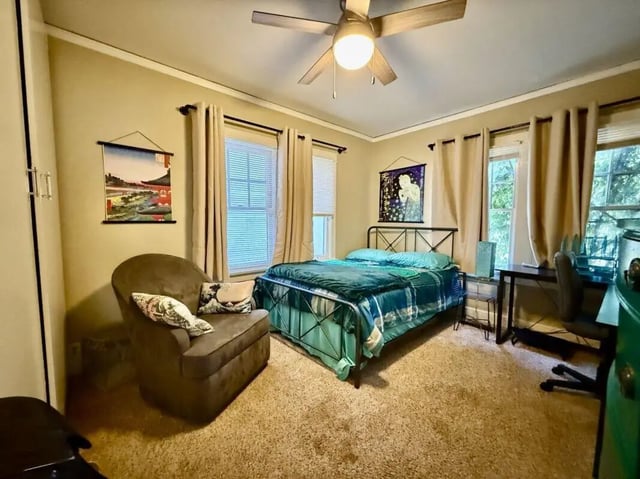 Bed armchair desk and bed bedroom at Universal Student Housing in Los Angeles Student Accommodation