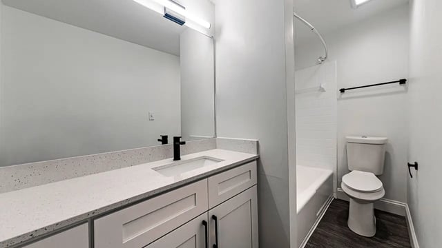 Modern bathroom vanity toilet tub and shower. at Victory East Lansing in East Lansing Student Accommodation