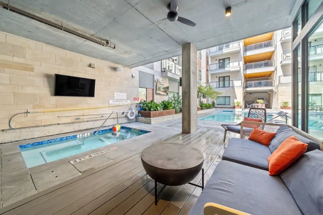 Sofa pool and television exterior living area at The Villas at San Gabriel in Austin Student Accommodation
