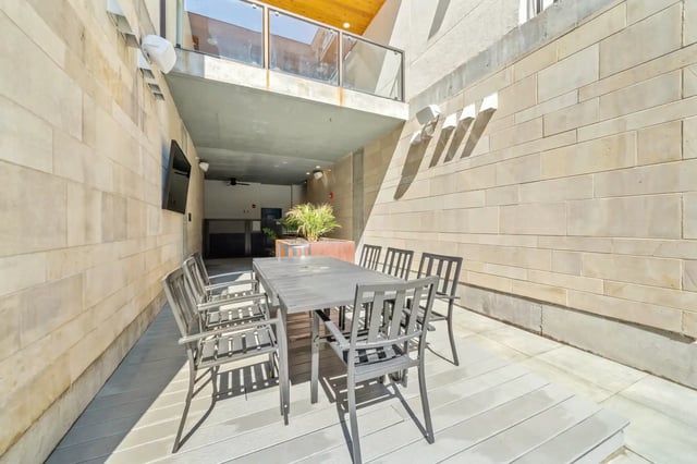 Outdoor dining table and chairs patio area at The Villas at San Gabriel in Austin Student Accommodation