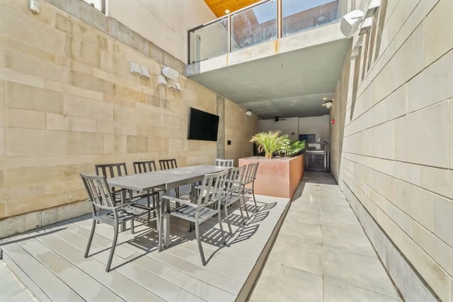 Outdoor dining table and chairs balcony area at The Villas at San Gabriel in Austin Student Accommodation