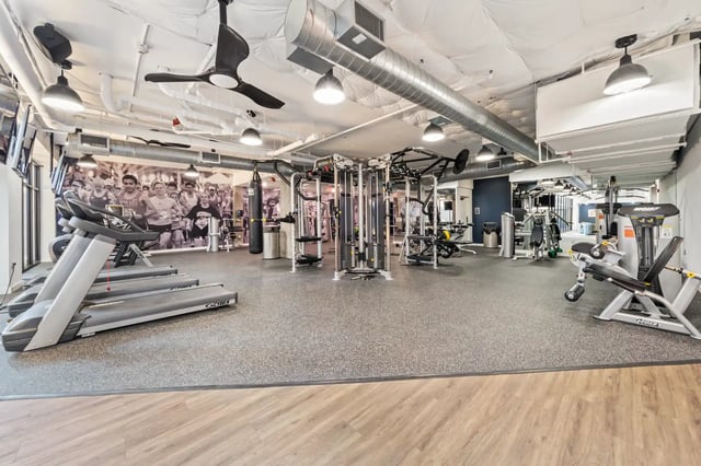 Treadmills weight machines punching bag gym. at The Villas at San Gabriel in Austin Student Accommodation