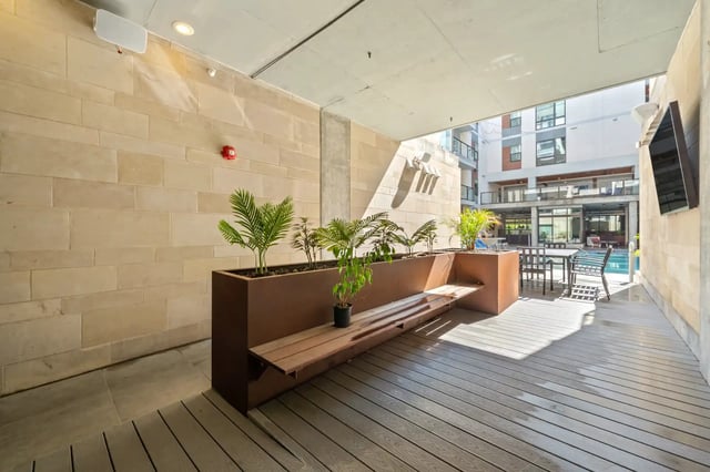 Bench plants and table exterior at The Villas at San Gabriel in Austin Student Accommodation