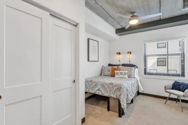 Sliding doors bed pillows chair window bedroom at The Bridge on Forbes Apartments in Pittsburgh Student Accommodation