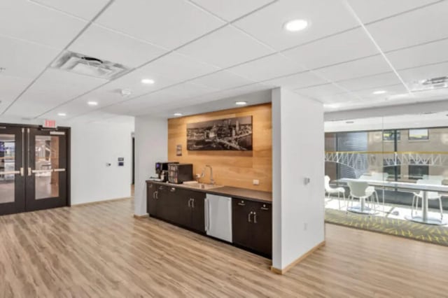 Coffee station with mini fridge and dining area. at The Bridge on Forbes Apartments in Pittsburgh Student Accommodation