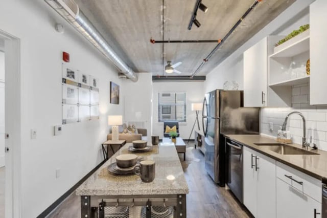 Island dining table kitchen living room exterior at The Bridge on Forbes Apartments in Pittsburgh Student Accommodation