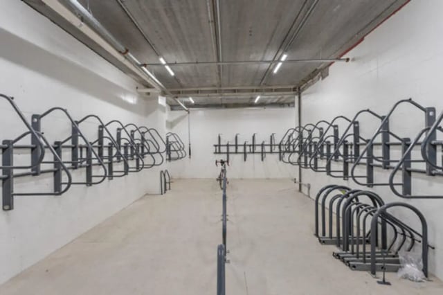 Wall mounted bike racks and floor racks parking area at The Bridge on Forbes Apartments in Pittsburgh Student Accommodation