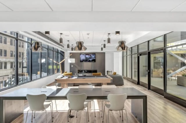 Pool table lounge area with seating and television common area at The Bridge on Forbes Apartments in Pittsburgh Student Accommodation