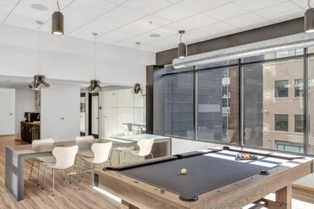 Pool table and dining table living area at The Bridge on Forbes Apartments in Pittsburgh Student Accommodation