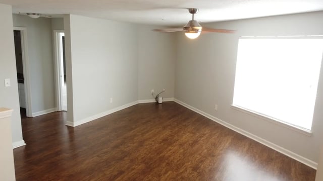 Empty room with wood floor ceiling fan living room at The Landing in West Lafayette Student Accommodation