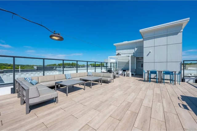 Rooftop seating area with couches tables and chairs exterior at The Landing in West Lafayette Student Accommodation