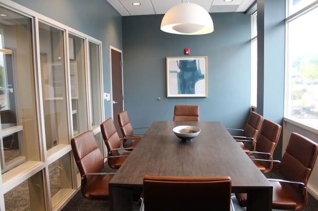 Conference room with brown chairs and long table Meeting room at The Landing in West Lafayette Student Accommodation