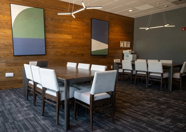 Large wooden table and chairs study area at The Landing in West Lafayette Student Accommodation
