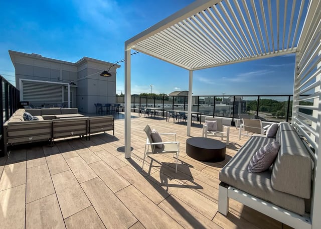 Outdoor seating area with sofas tables and chairs Exterior at The Landing in West Lafayette Student Accommodation