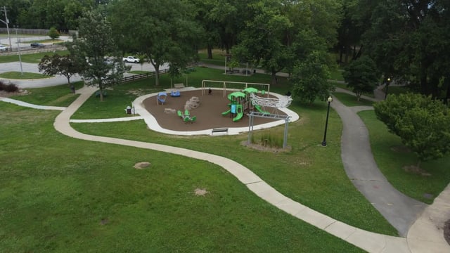 Playground with swings slides and climbing structure exterior at The Landing in West Lafayette Student Accommodation