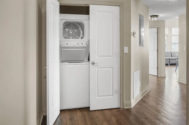 Stacked washer dryer laundry closet view at 10 North in Bloomington Student Accommodation