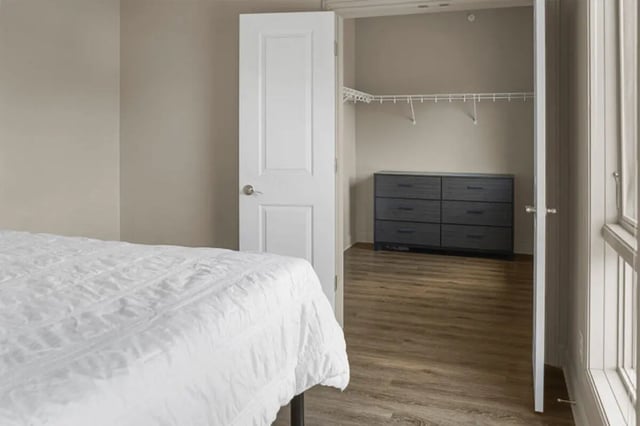 White duvet dresser and closet interior bedroom at 10 North in Bloomington Student Accommodation