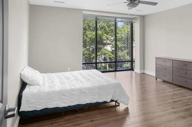 Bed dresser ceiling fan large window bedroom at 10 North in Bloomington Student Accommodation