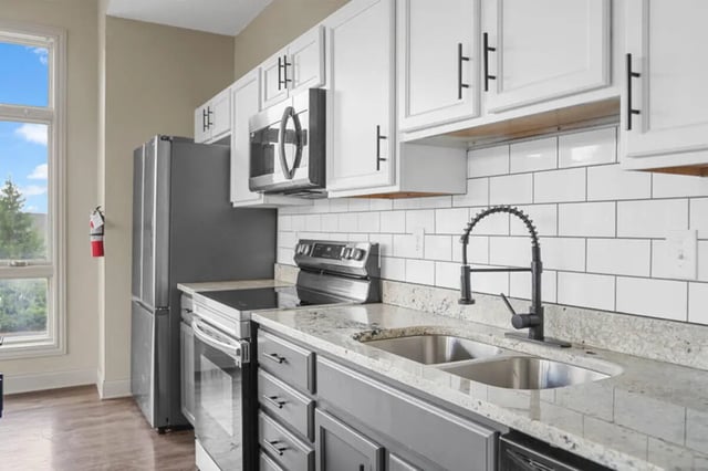 Refrigerator stove microwave sink cabinets kitchen at 10 North in Bloomington Student Accommodation