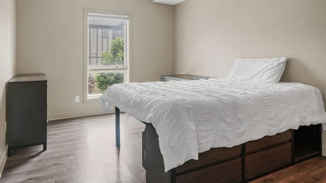 Bed dresser window room bedroom at 10 North in Bloomington Student Accommodation