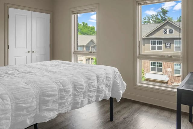 White duvet bed with double doors bedroom at 10 North in Bloomington Student Accommodation