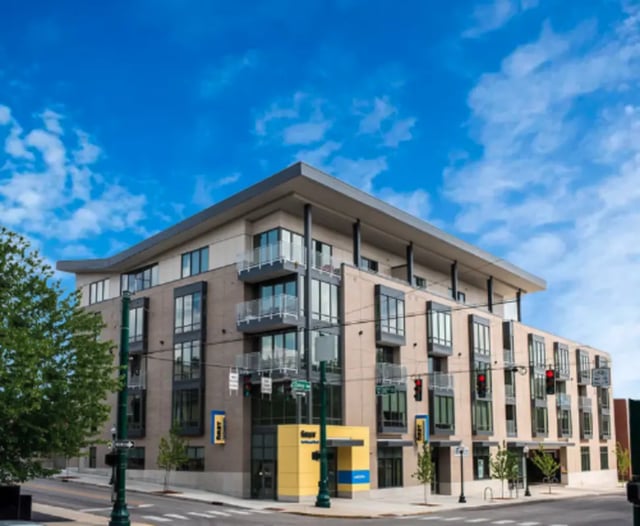 Modern apartment building with balconies and large windows exterior at 10 North in Bloomington Student Accommodation