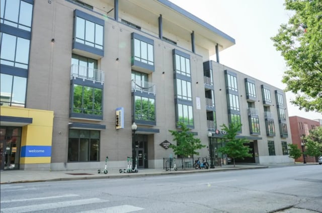 Apartment building with scooters and bikes exterior at 10 North in Bloomington Student Accommodation