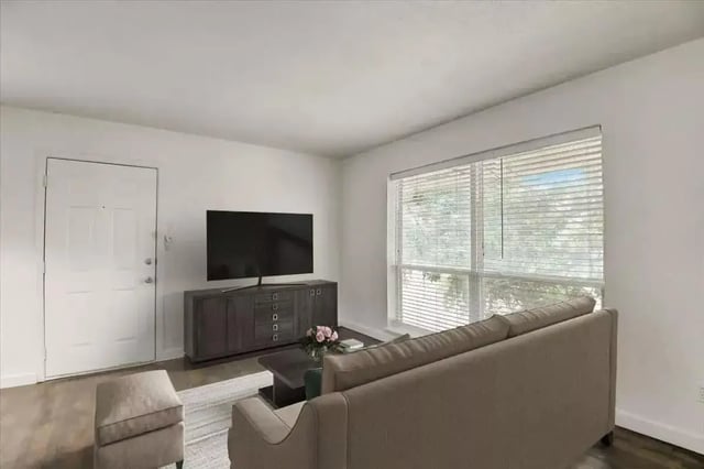 Sofa television cabinet coffee table living room at Across The Street Apartments in Denton Student Accommodation