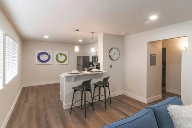 Modern kitchen counter bar with stools living area at Aero Apartments in Davis Student Accommodation