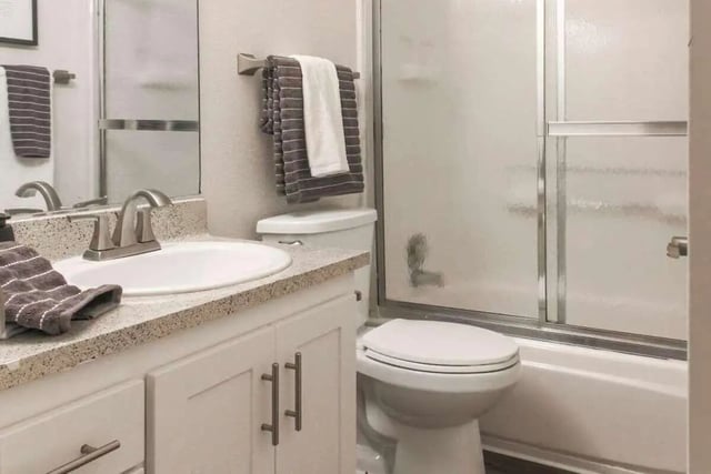 Sink toilet shower with towels bathroom at Aero Apartments in Davis Student Accommodation