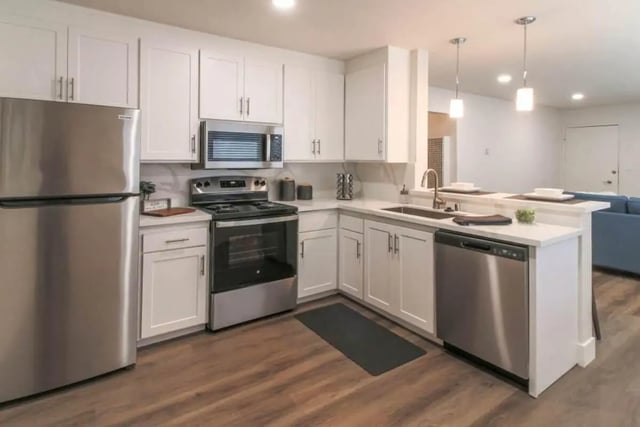 Stainless steel appliances modern white cabinets kitchen at Aero Apartments in Davis Student Accommodation