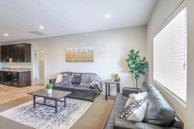 Leather sofas coffee tables rug living room at CollegePlace Woodland in Provo Student Accommodation