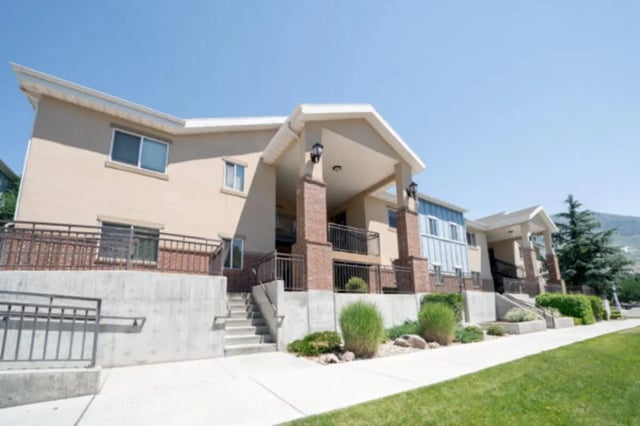 Apartment building exterior with balconies and windows exterior at CollegePlace Woodland in Provo Student Accommodation