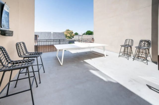 Outdoor patio with table and chairs balcony area at CollegePlace Woodland in Provo Student Accommodation