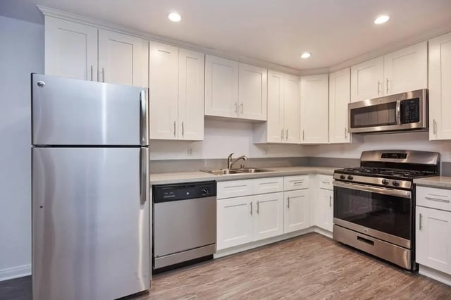 Stainless steel appliances white cabinets sink kitchen at Ariel Court in Los Angeles Student Accommodation