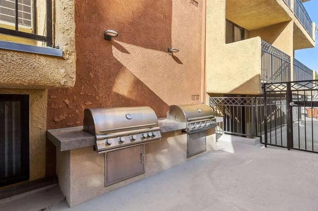 Two stainless steel grills with cabinets outdoor area at Ariel Court in Los Angeles Student Accommodation