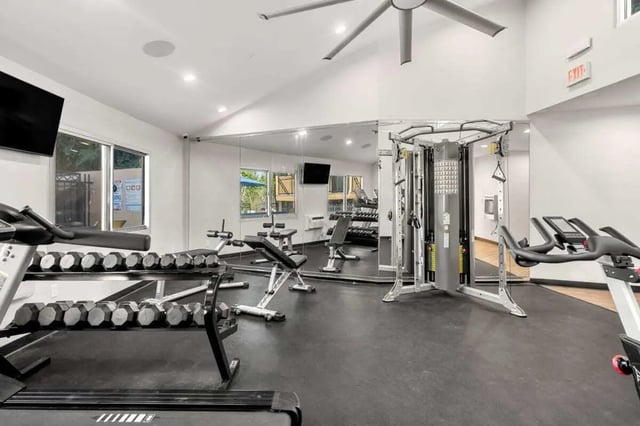 Treadmills dumbbells weight machine gym interior at Ariel Court in Los Angeles Student Accommodation