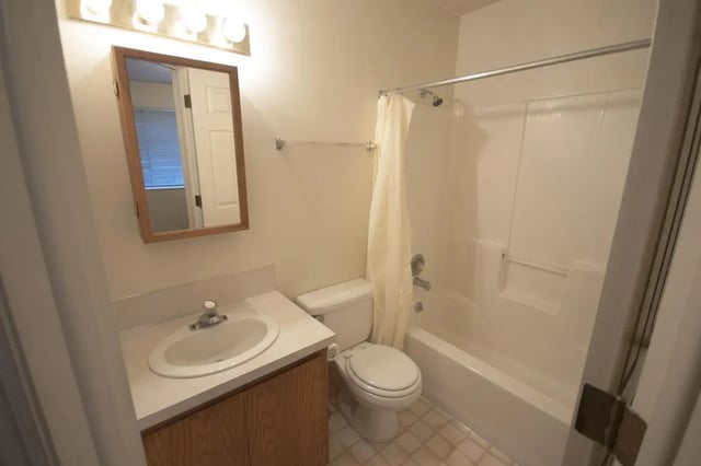 Sink toilet shower curtain bathtub bathroom at Afton Apartments in Logan Student Accommodation