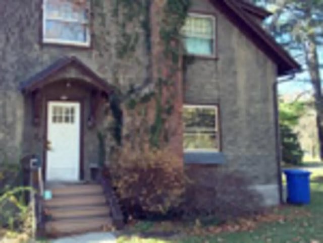 Entrance with white door and steps exterior at Ashley Management Corporation in Ithaca Student Accommodation