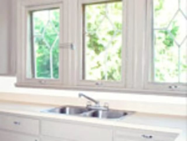 Double sink and windows student kitchen at Ashley Management Corporation in Ithaca Student Accommodation