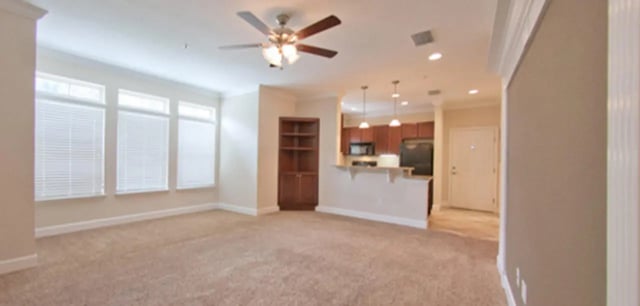 Living room with windows ceiling fan kitchen living room exterior at Ashton Lane Luxury Apartments in Gainesville Student Accommodation