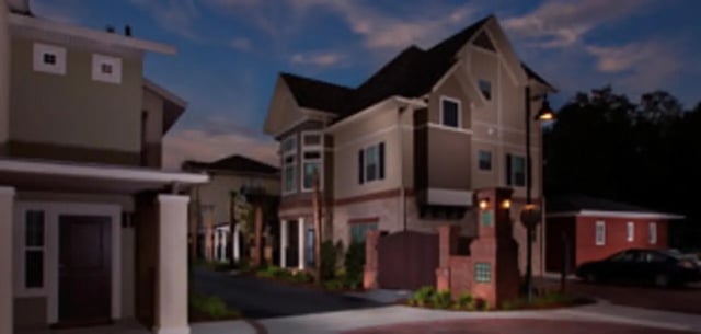 Townhouses with streetlights and driveway exterior at Ashton Lane Luxury Apartments in Gainesville Student Accommodation